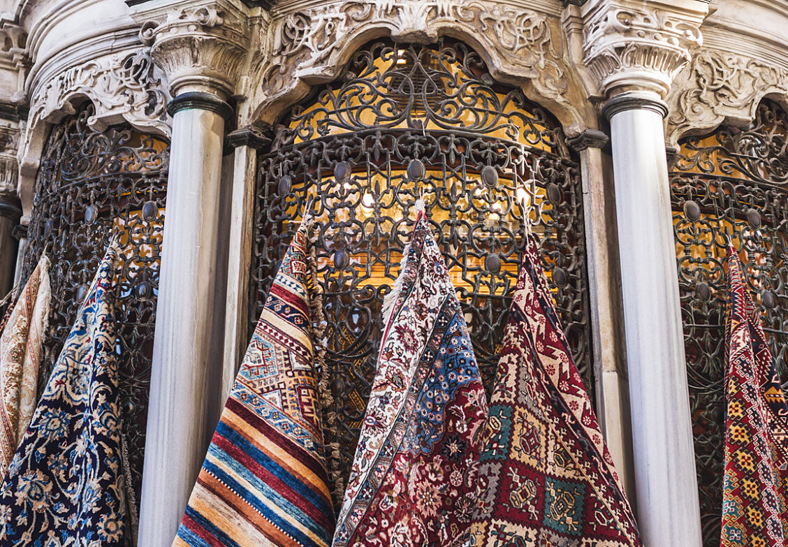 colorful Turkish rugs hanging on a wall