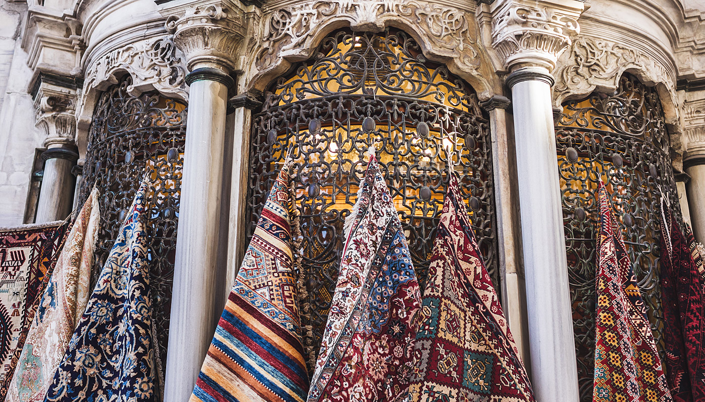 colorful Turkish rugs hanging on a wall